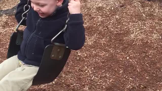 Toddler and German Shepherd have fun playing together