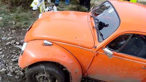 Orange VW Beetle on hill climb