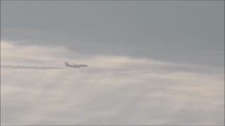 Airplane flying through a "contrail"