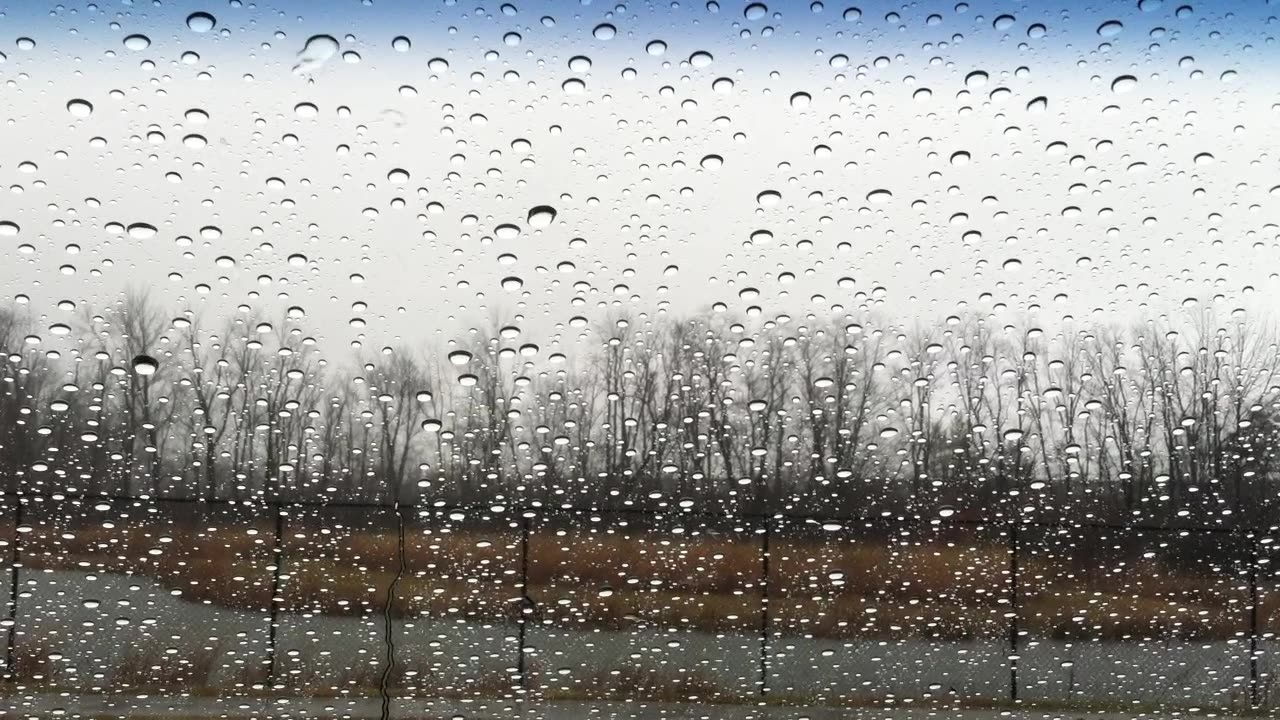 Rain pouring down on windshield