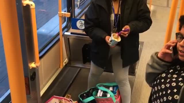 Woman in bus asleep while standing