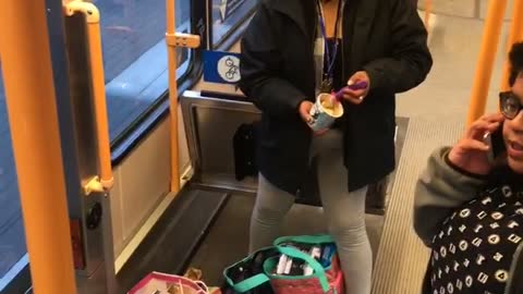 Woman in bus asleep while standing