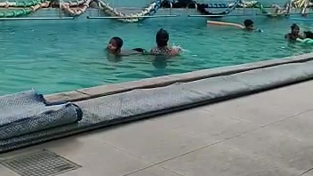 autistic boy bathing in pool