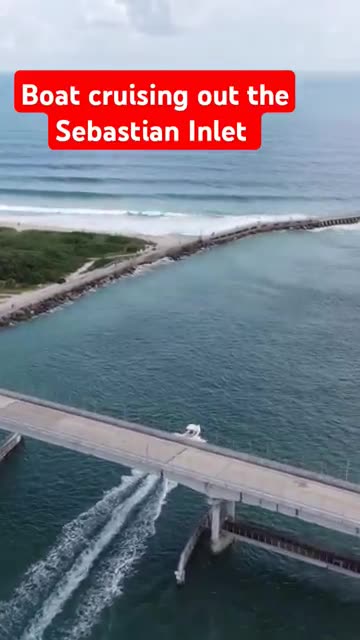 Boat cruising out the Sebastian Inlet