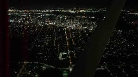 Flying over vancouver at night