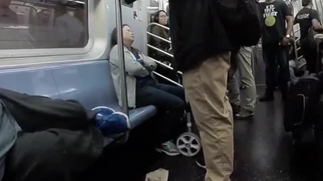Fish eye lense man in blue shirt passed out on train