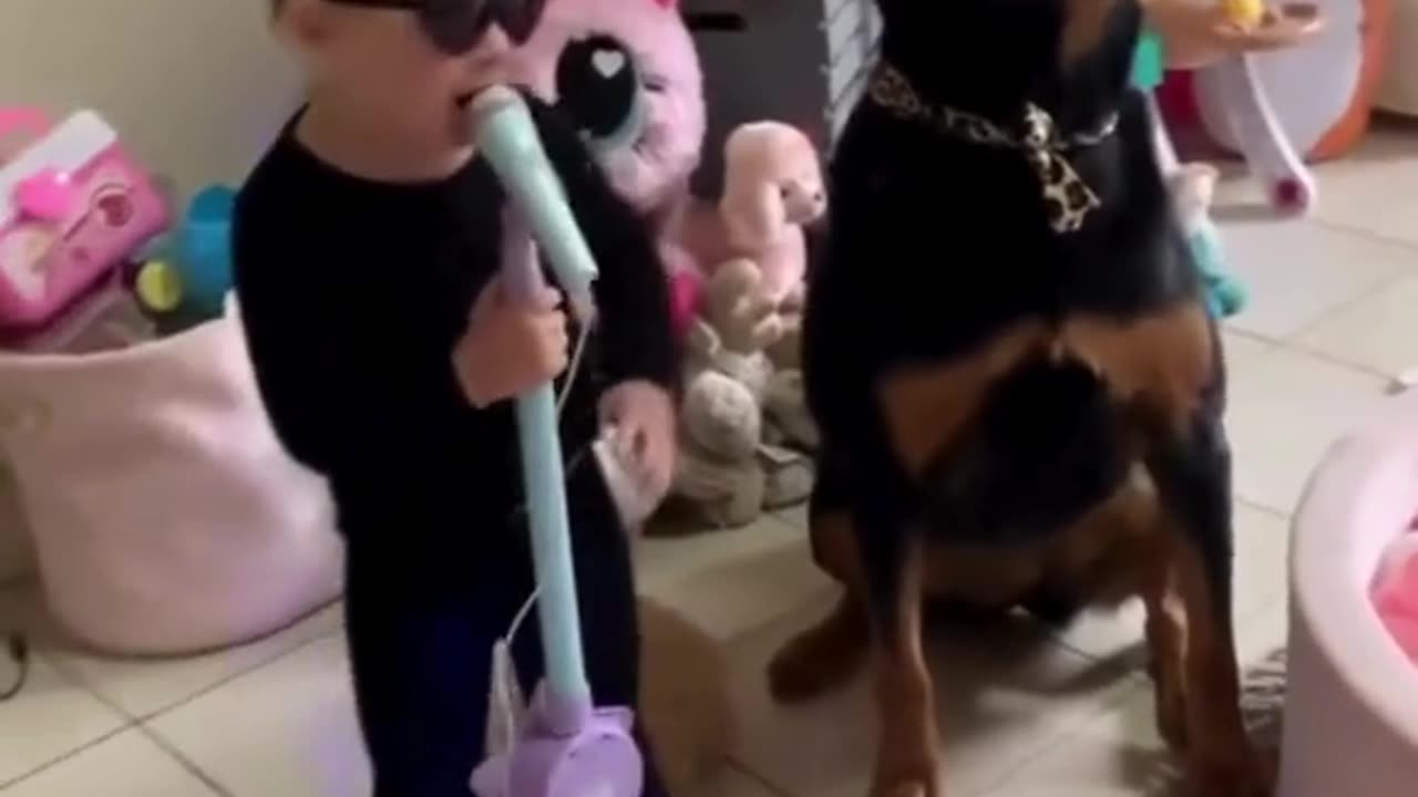 Girl and Dog Make a Great Singing Duo: Adorable Performance!