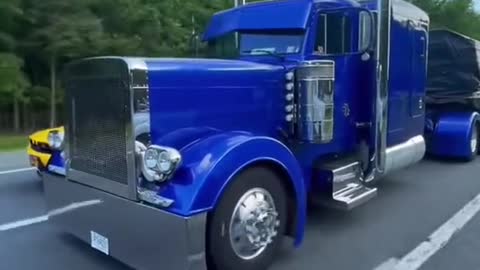 You can't get tired of watching an American truck driver. What's that Hellcat next to him?