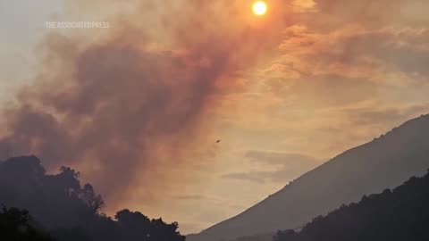 Firefighters, military carry out efforts to extinguish wildfires in southern Albania.mp4