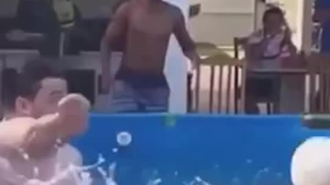 My Fatty Brother Is Trying To Kick A Football From Pool.