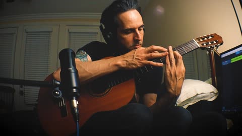Instrumental in Em, tapping on a nylon string/ classical guitar
