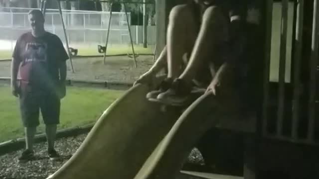 Guy goes down yellow slide skateboard