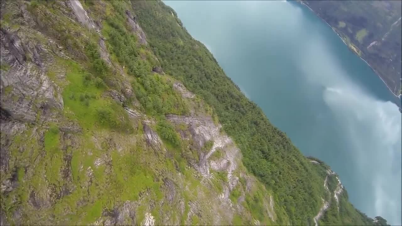 BASE jump POV over stunning Norwegian landscape