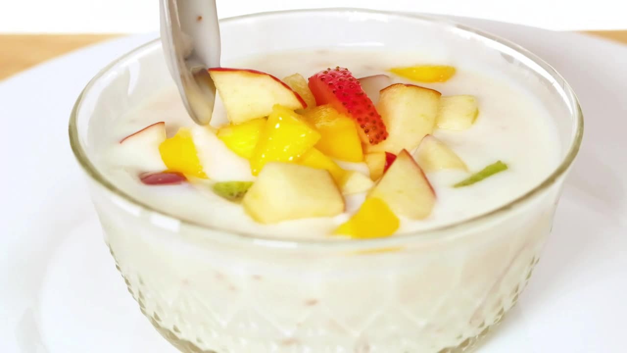 Bowl with yogurt served with chopped fruit