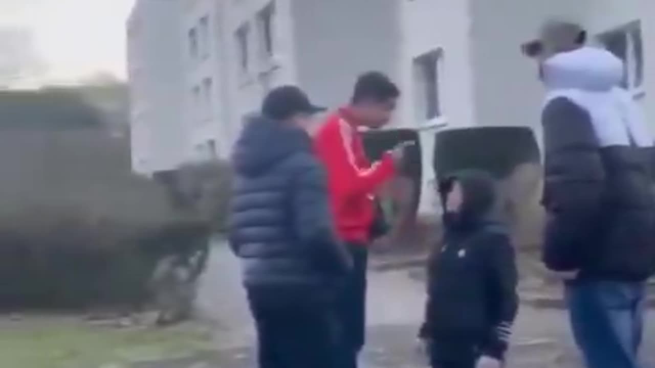 fake asylum seekers threaten & beat a shy German boy who is forced to kneel.