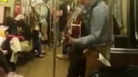Guy named Shane playing guitar on the R train in Manhattan