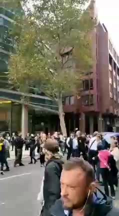 Outside The Bill and Melinda Gates HQ London People Are Demanding His Immediate Arrest