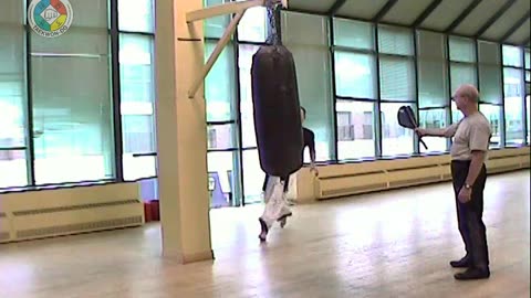 focus-pad-off-the-wall-roundhouse-kick-right-leg-front-view