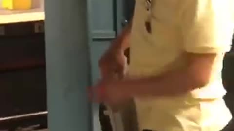 Man gets hot and plugs fan into wall at subway station