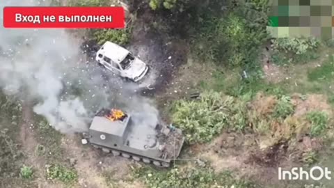 Russian troops push Ukrainian armored vehicles in Komarovka.