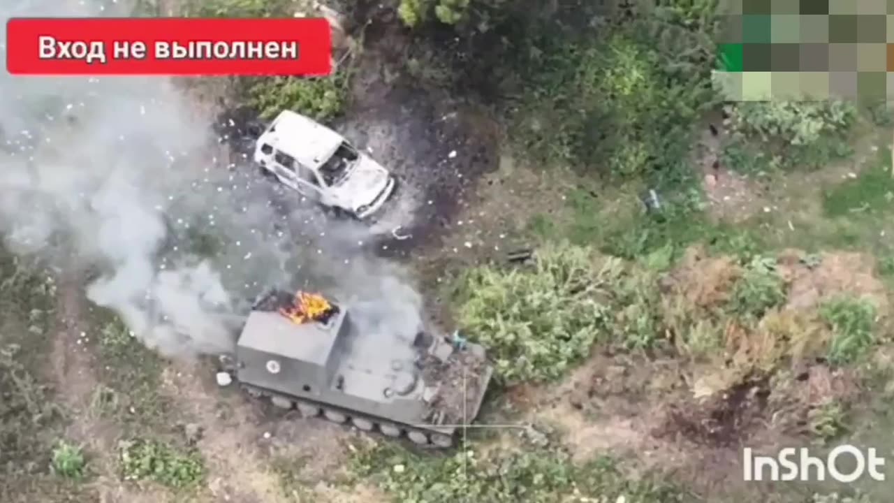 Russian troops push Ukrainian armored vehicles in Komarovka.