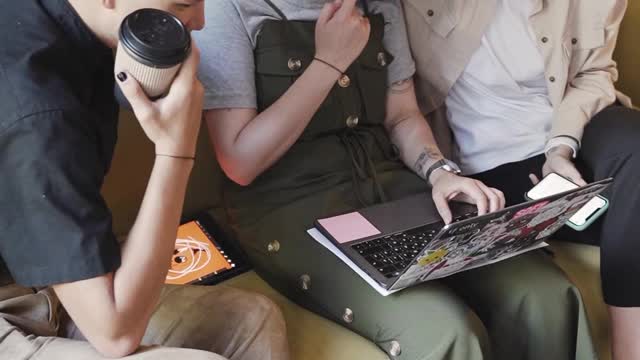 People Looking at a Laptop