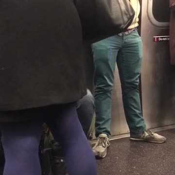 Bearded guy knits blue yarn in subway