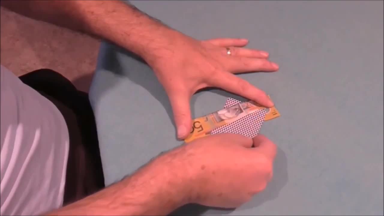 A Playing Card Slices Through A Bill With No Damage Noted