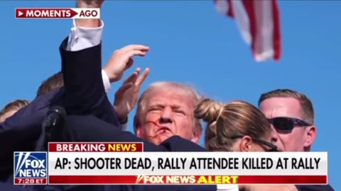 AP reports the shooter is dead. A member of the audience is dead and another wounded.