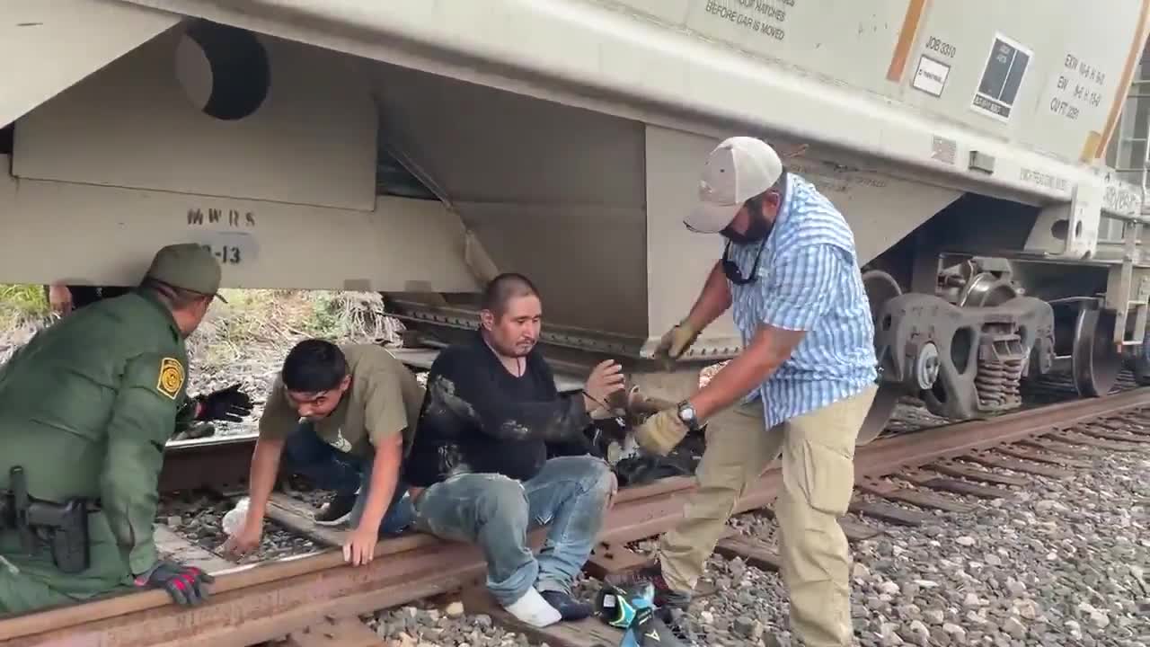 20+ illegals stuffed into a train cart grain hopper