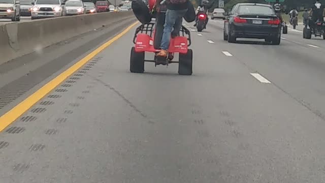 Woman Gets Mobbed By A Bunch of Stunt Riders On the Freeway