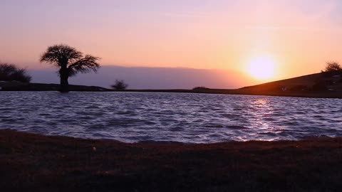 The setting sun, a red cast sunset sky, so beautiful!