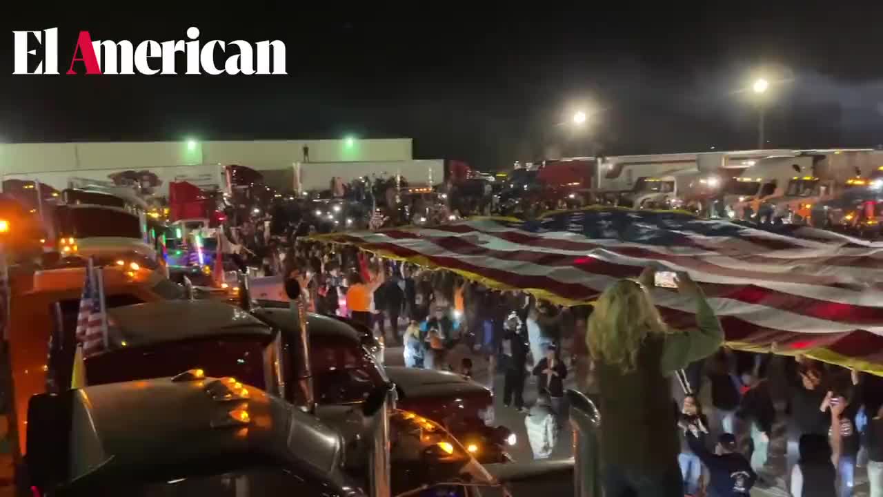 Crowds Rally in Indianapolis, IN, Holding up a Giant American Flag in Support of the People’s Convoy