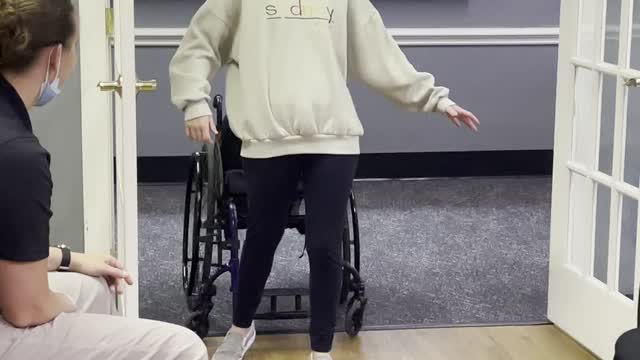 Natalie walking during therapy.