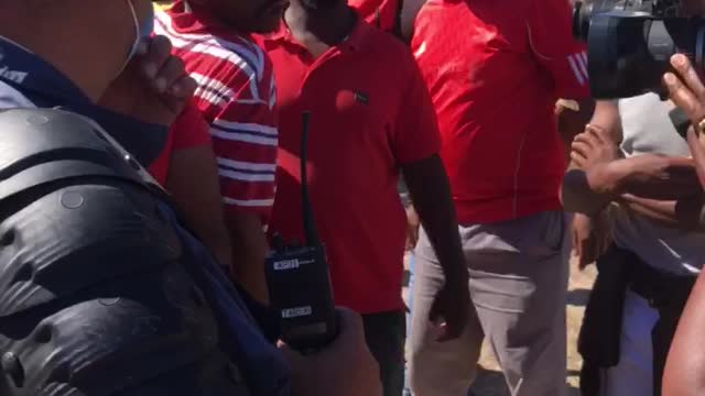 EFF supporters arguing with Police