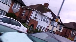 Beautiful houses view while driving in the car in the UK