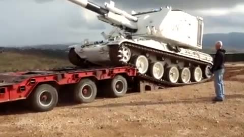 White Tank Falls off Flatbed Trailer