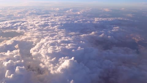 airplane fly over the cloud