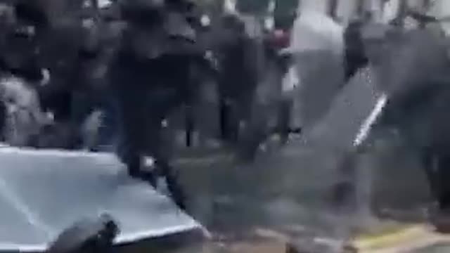 Chaos! French black masked man chases police