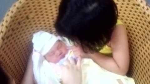 Clip cute 5-year-old sister and love for newborn girls