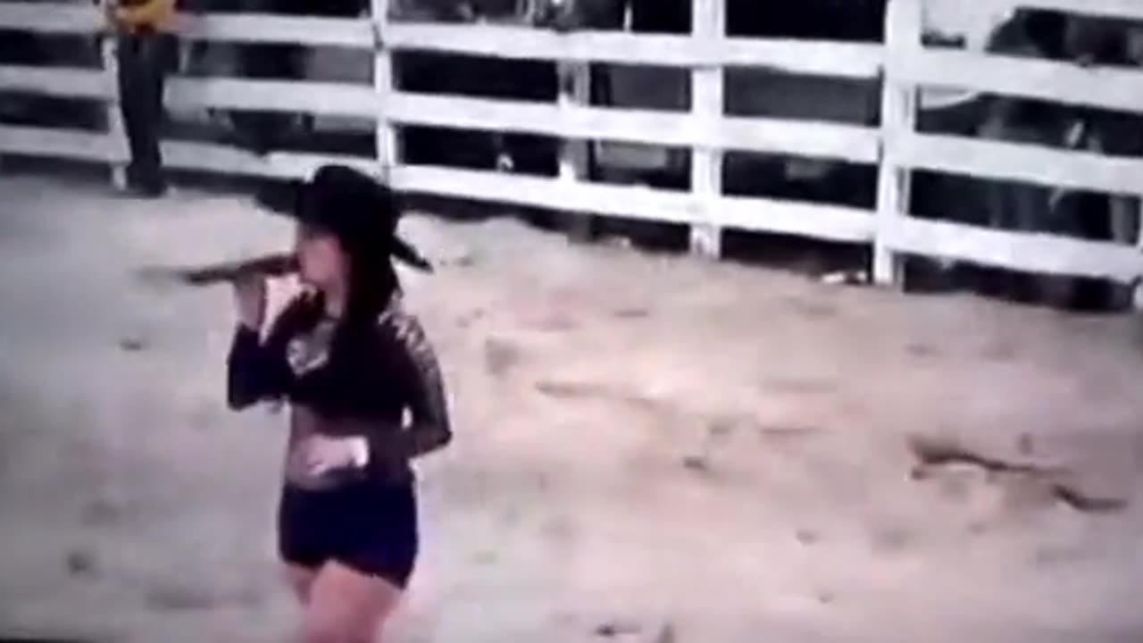 chick singing before rodeo gets mowed down by an escaped bull.