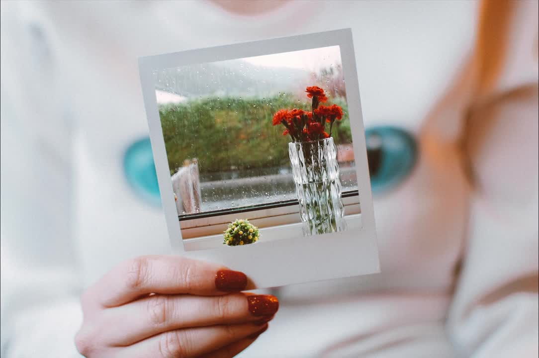 Woman Holding Polaroid