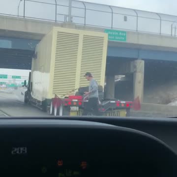 Truck hauling expensive generator hits overpass.