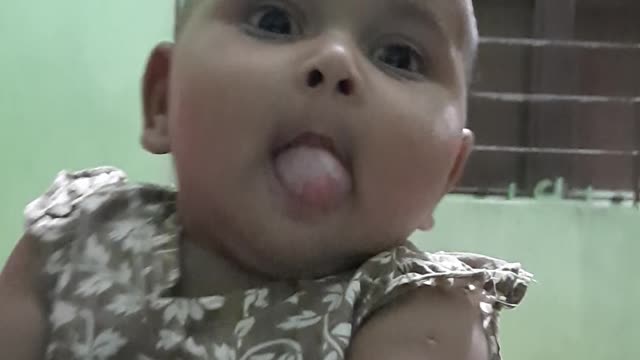 Cute Babu is showing his tongue