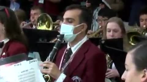 Masked Clarinetist in Harvard Orchestra