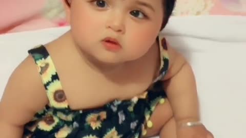 Cute baby looking at something