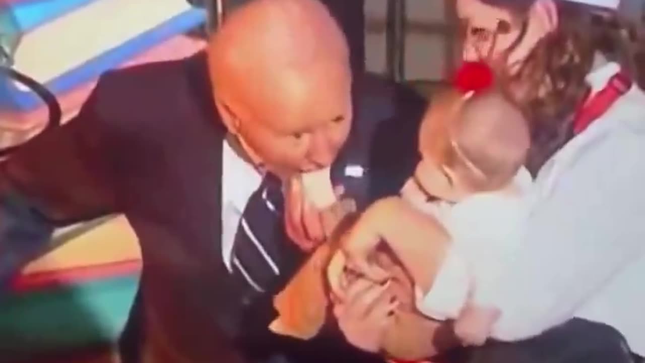 Joe Biden sucking a baby’s foot at the White House