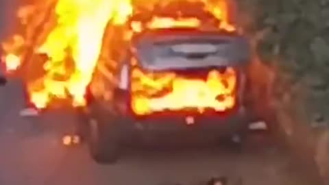 Car burning in the aftermath of a communication device explosion in Lebanon