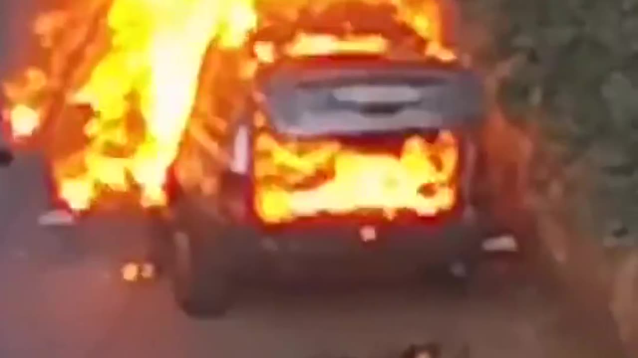 Car burning in the aftermath of a communication device explosion in Lebanon