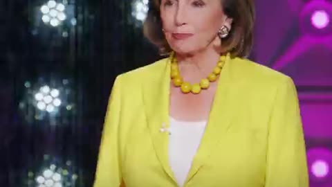 Nancy Pelosi speaking lies in front of Drag Queen RuPaul